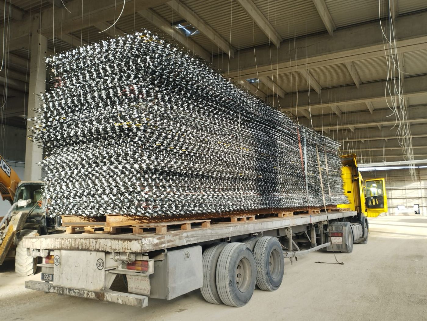 Truck loaded with stacked reinforcing mesh panels