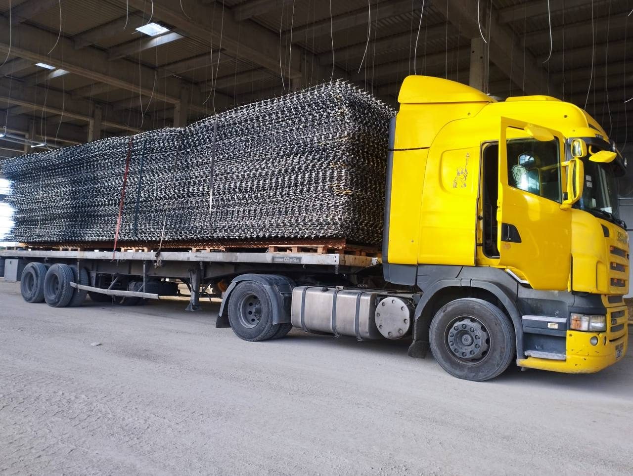 Truck loaded with stacked reinforcing mesh panels