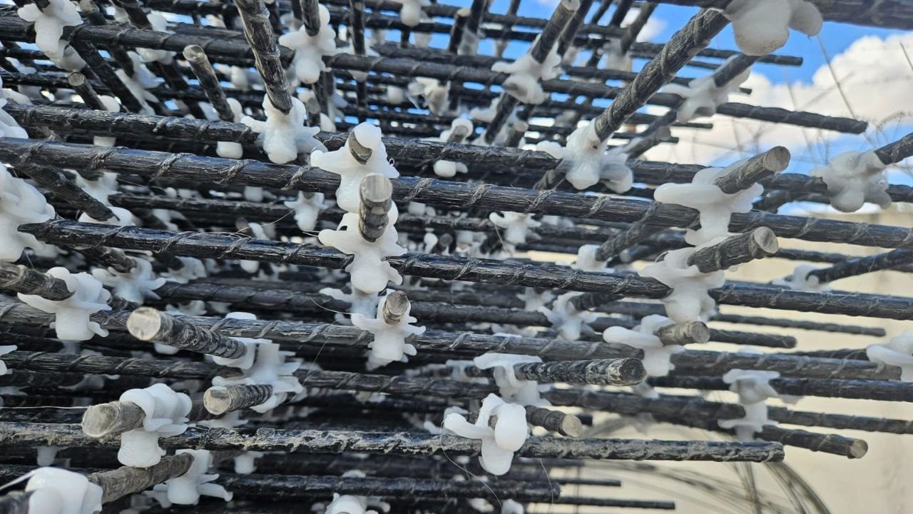 Layers of GFRP reinforcing mesh fitted with spacers